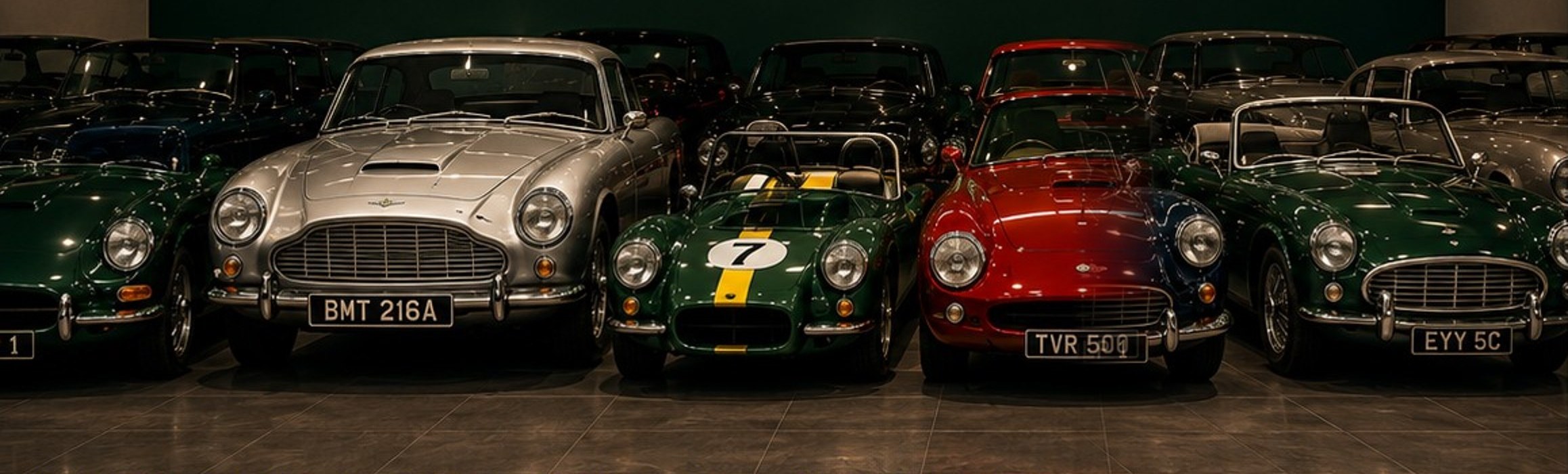 A line-up of classic British sports cars inside the DLP Classic and Sportscars showroom, Northumberland